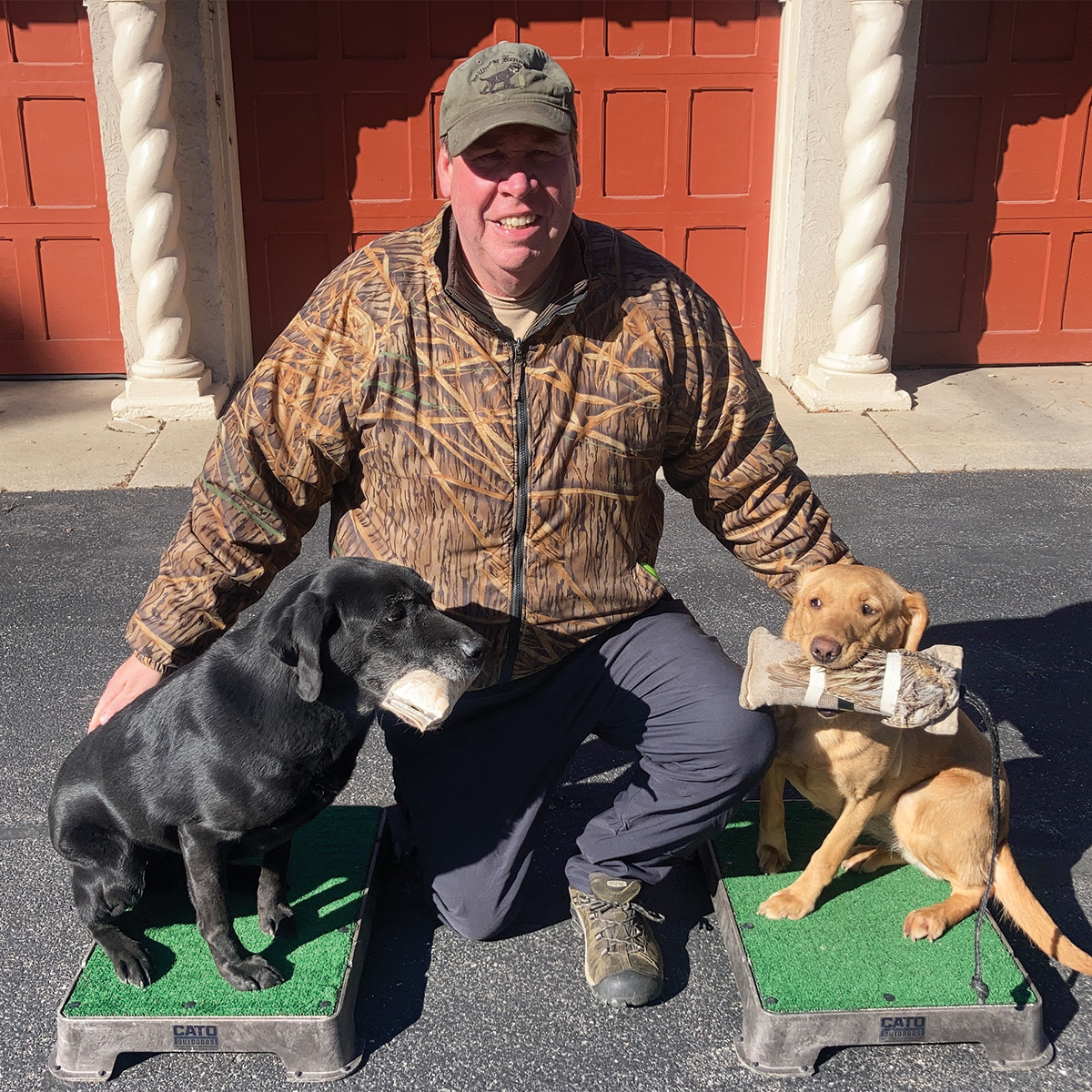 Al Klotsche of Wildrose Kennels Midwest with retrievers.jpg